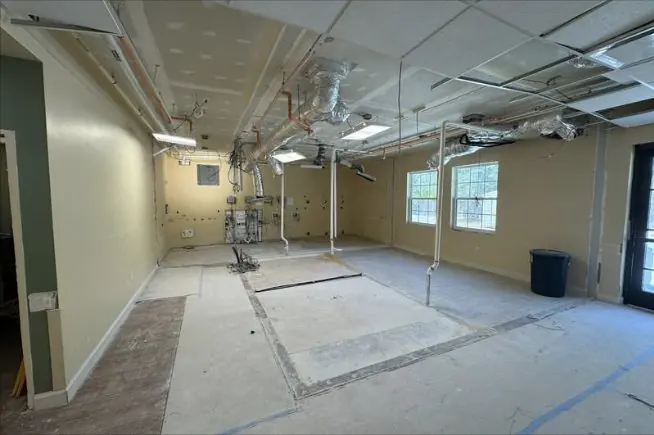 Room stripped to the floor with utilities capped